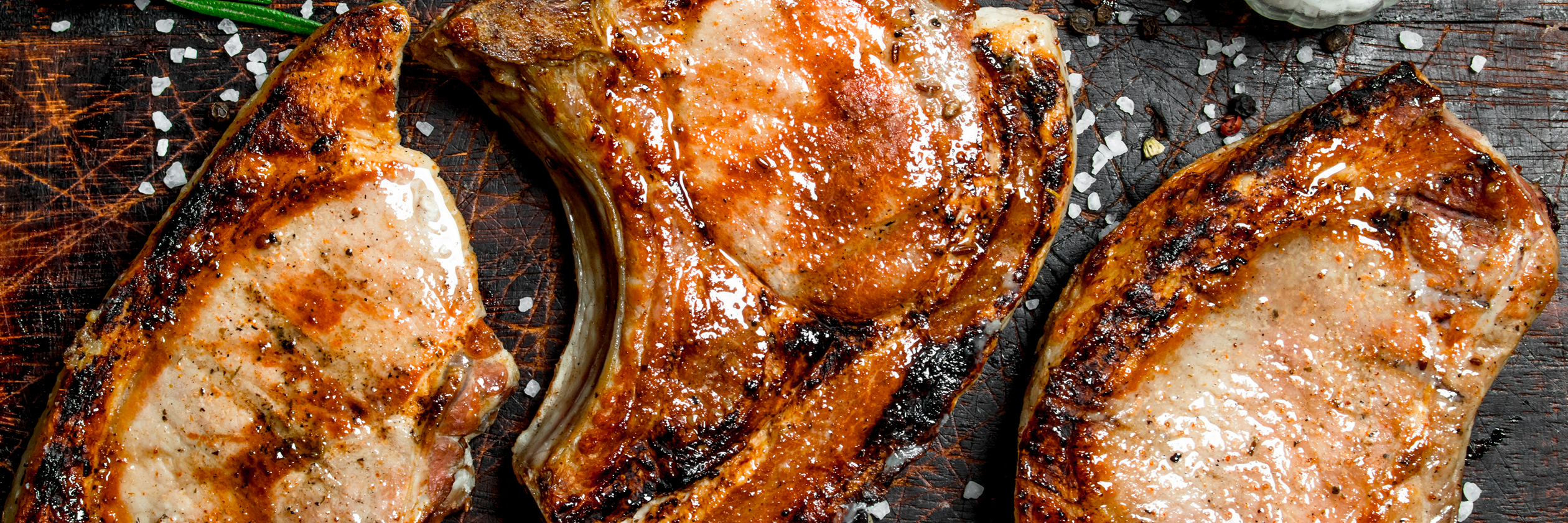 grilled pork steaks with rosemary and salt on an o 2024 09 12 22 25 02 utc 1